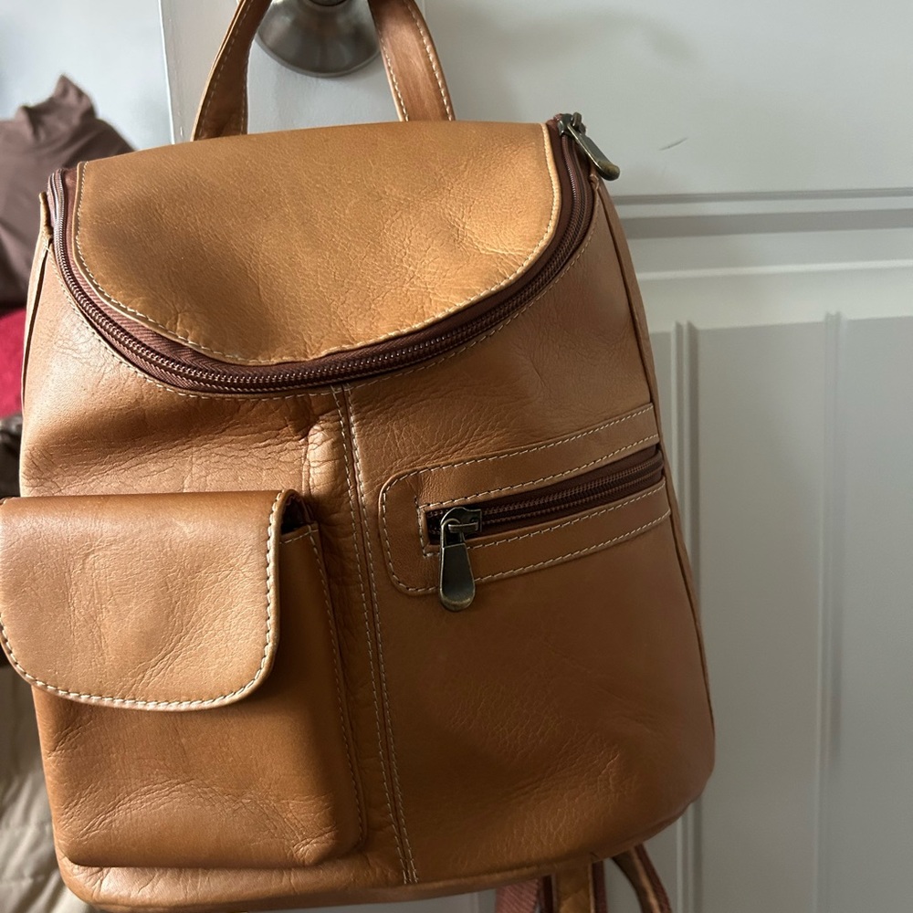 LeDonne Leather Tan Backpack with Flap-Over Design and Matte Finish.